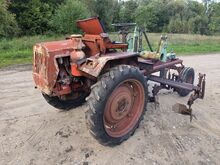Traktor T-16 koos muldajaga