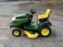 Садовый трактор John Deere X166