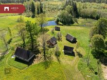 Maaliline kinnistu väikese maja, suitsusauna ja tiigiga