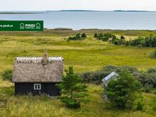 Merepiiriga 4,36 ha kinnistu palkmajaga arenevas Rässa külas